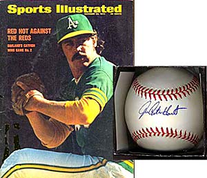 A Sports Illustrated featuring Catfish Hunter, and a Hunter-signed baseball.