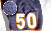Repair marks such as this one(shown enlarged) may be used to photo-match game used jerseys.