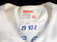 Sweat stains in the collar of this Joe Carter game used jersey are evidence of use.