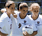 Above: American champs Julie Foudy (of Southern Calif.), Mia Hamm & Kristine Lilly pose for the press