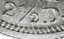 Genuine coins have well-formed lettering and numerals. 
