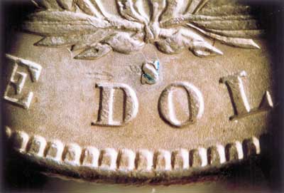 'S' is for sloppy, as there's a seam in evidence along with residue from the adhesive, among other problems.
